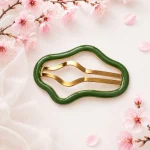 گیره مو طرح برگ سبز و طلایی